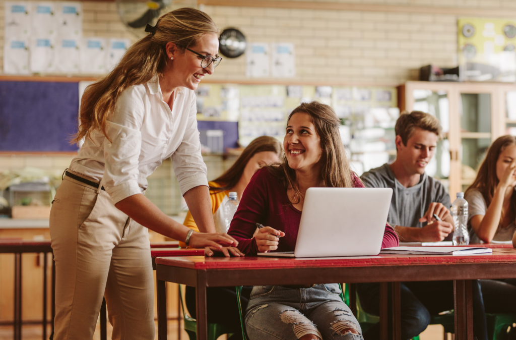 Student and Teacher at desk